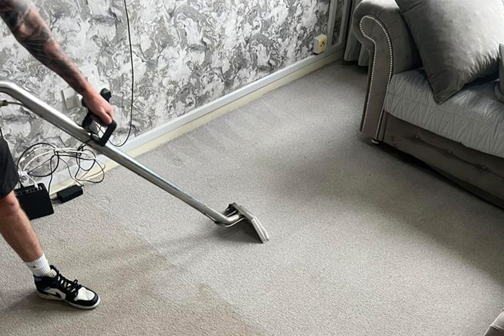 Person Cleaning Carpet